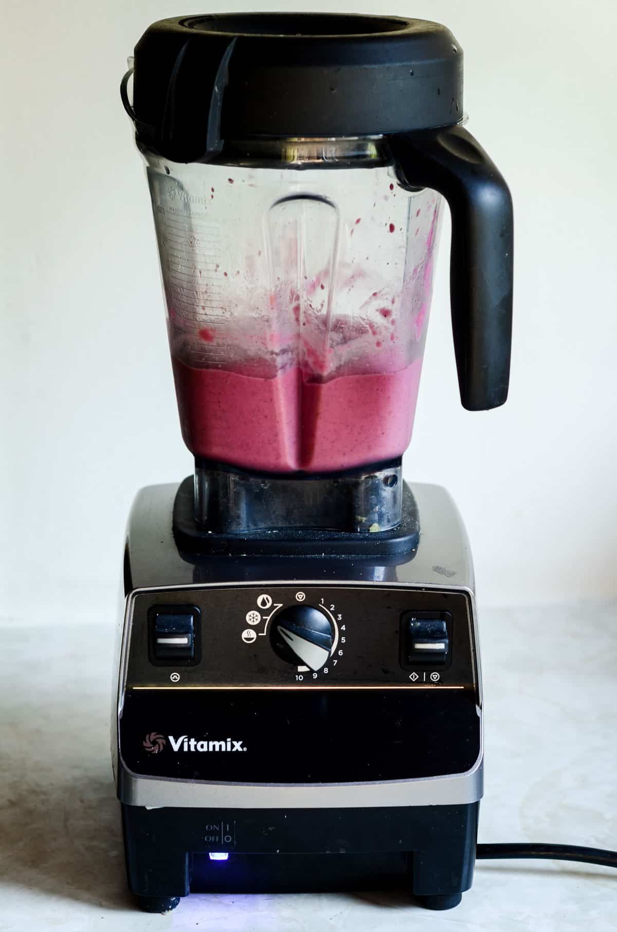 Pink smoothie from dragon fruit and pineapple in a vitamix blender.