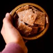 Healthy whole wheat crackers in a bowl with sea salt.