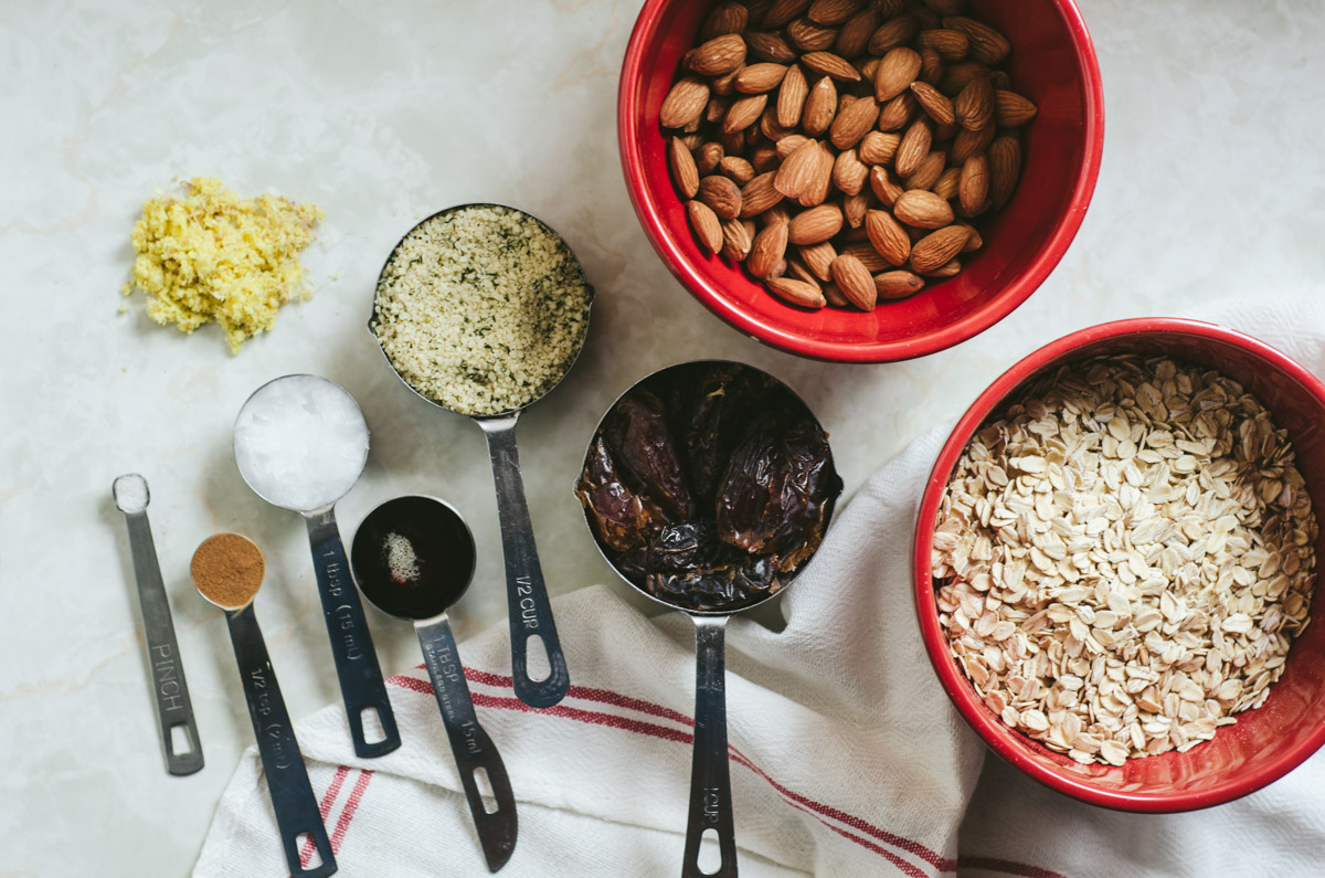 ingredients for healthy protein balls with dates and ginger measured on counter. 