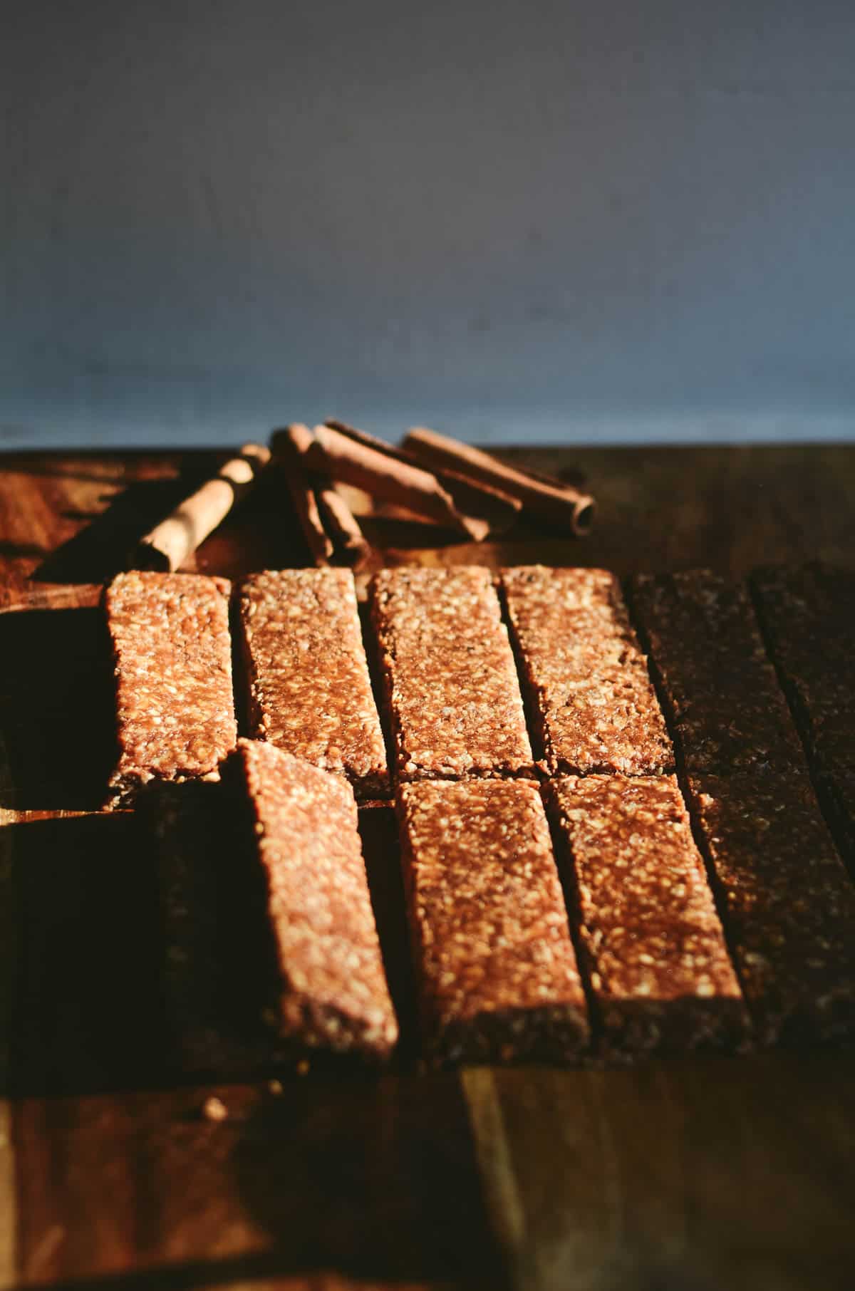Homemade simple healthy cinnamon granola bars on a cutting board.
