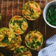 Egg bites with veggies on cooling rack.