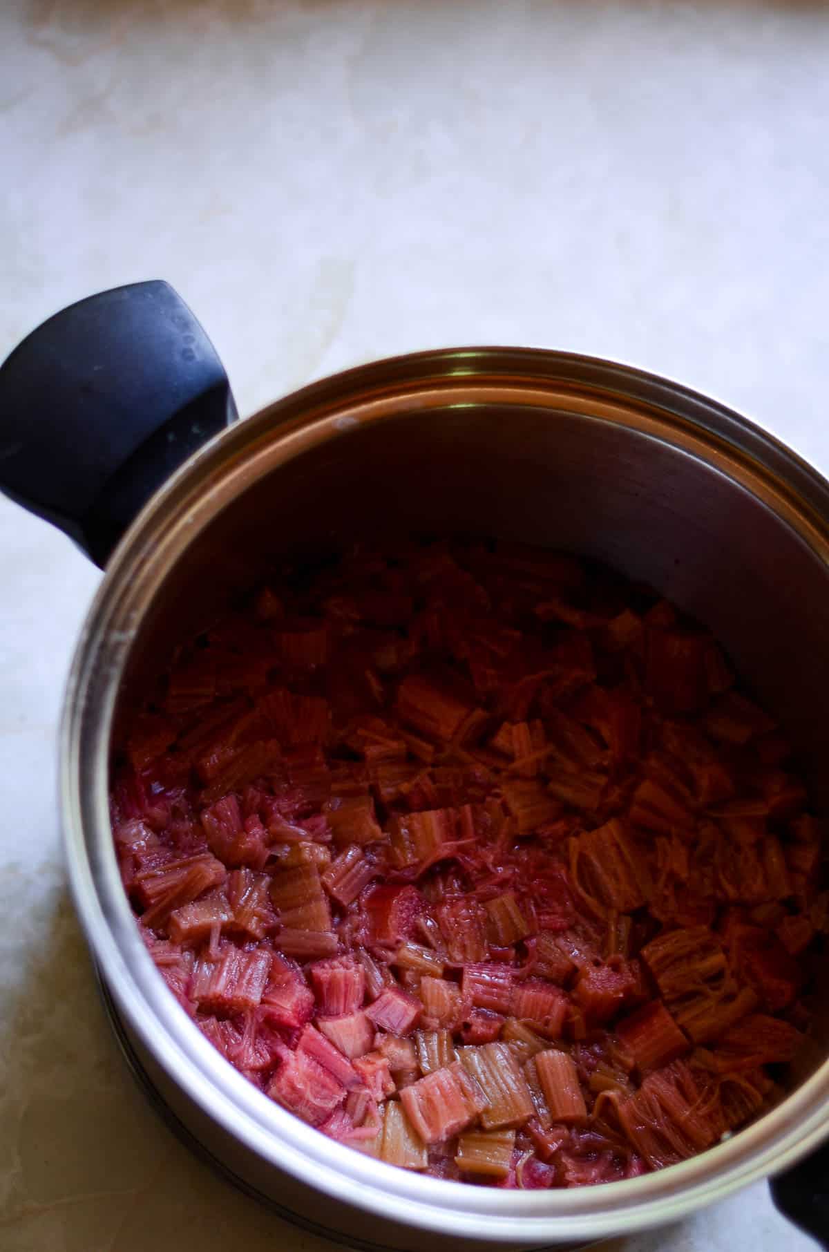 Chopped rhubarb in a pot cooked.