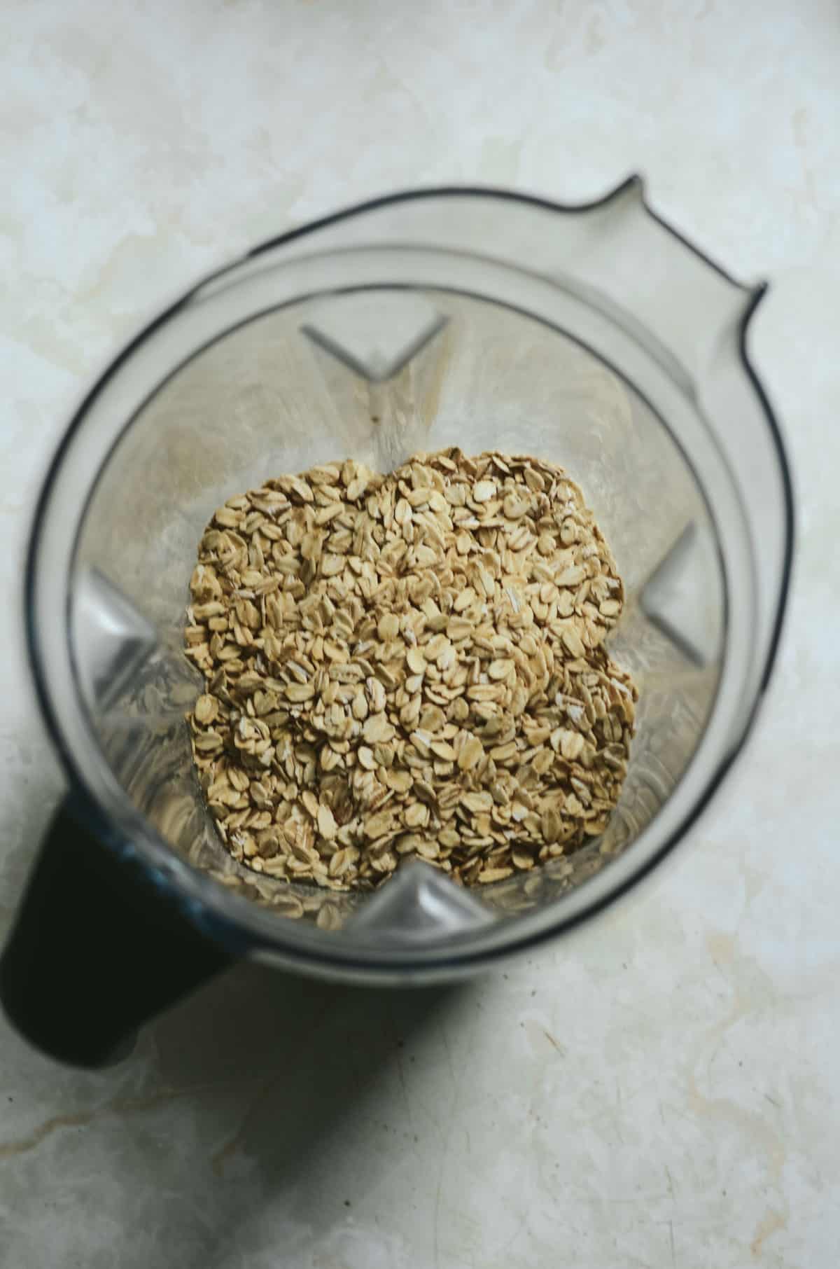 Rolled oats in the blender to make oat flour.