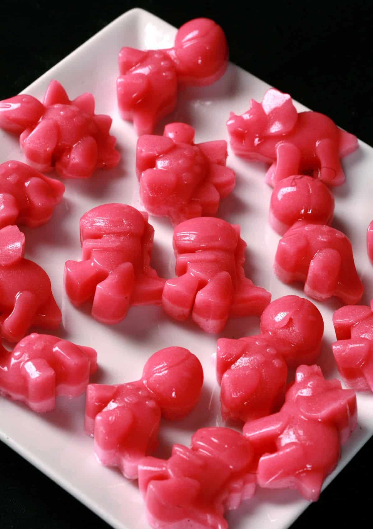 pink-dino-gummies-on-white-plate