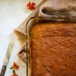 Pumpkin colored snack cake baked in a rectangular pan.