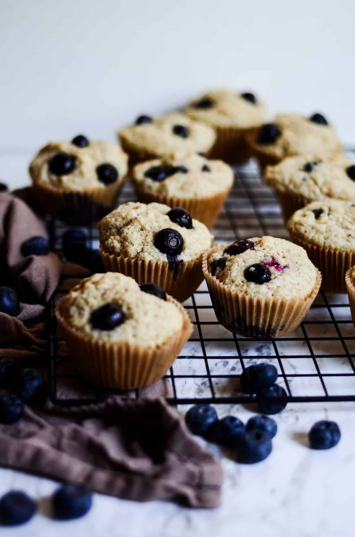 Beautiful blueberry muffins on a cooling rack. 