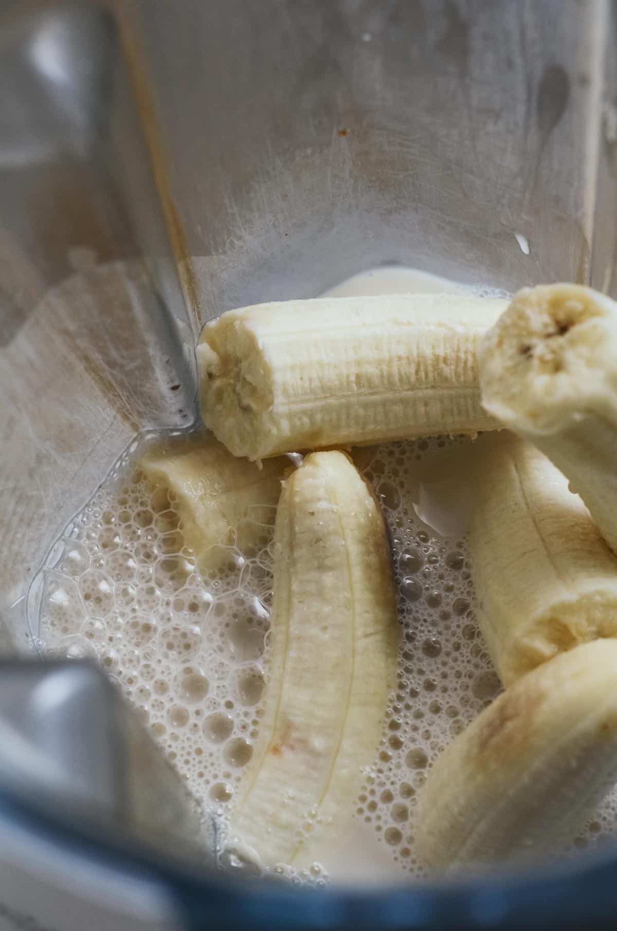 Bananas and milk in the vitamix container.