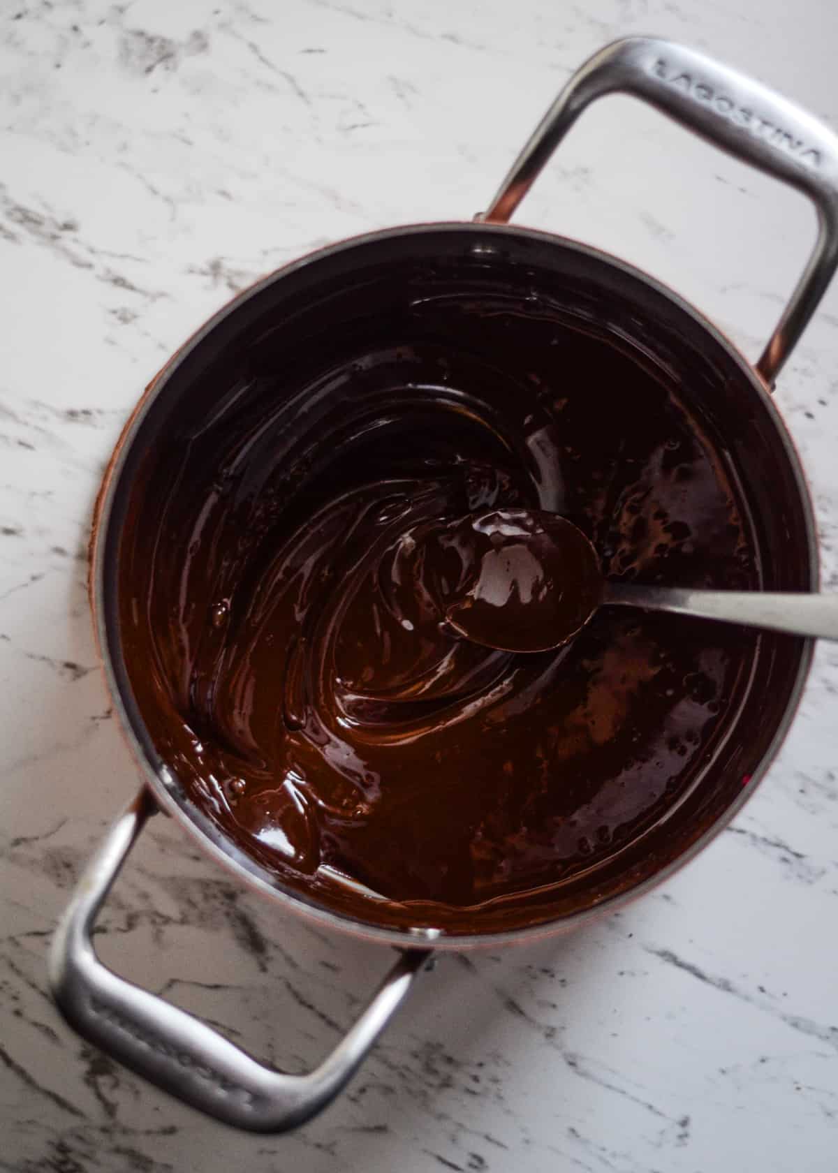 Melted dark chocolate in a pot.