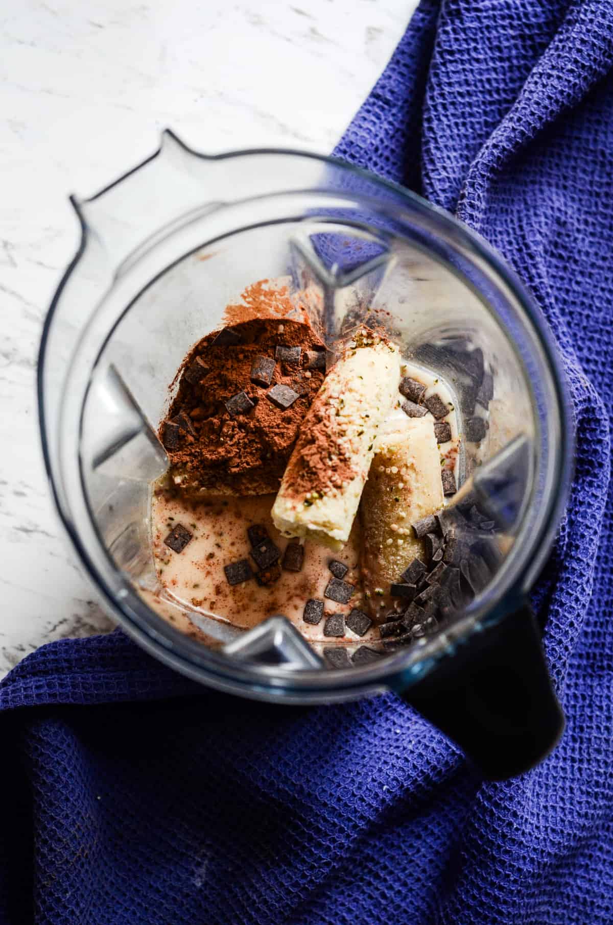 Banana, cocoa powder, hemp hearts, milk, in the vitamix container.