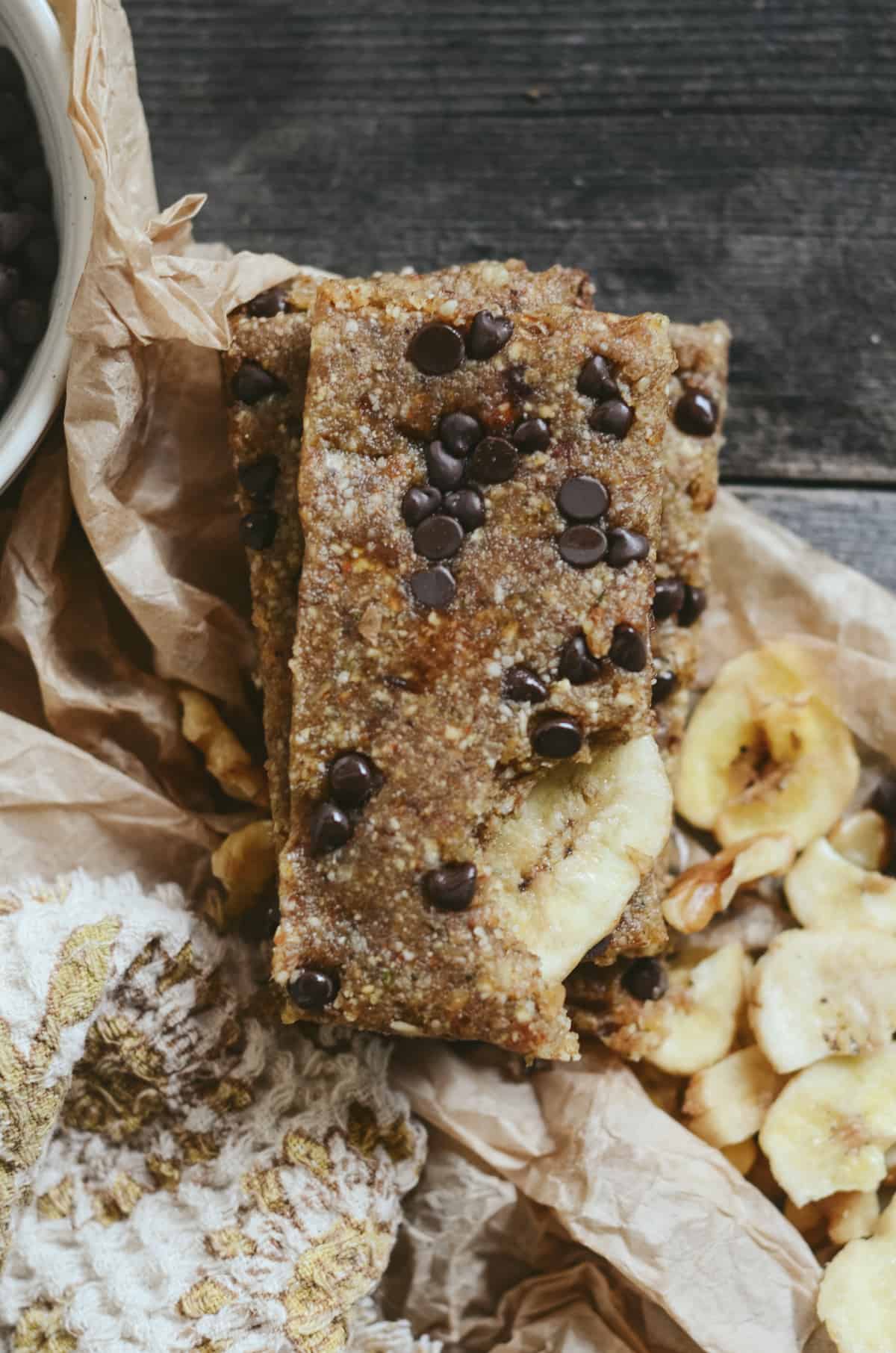 A brown protein bar with chocolate chips.