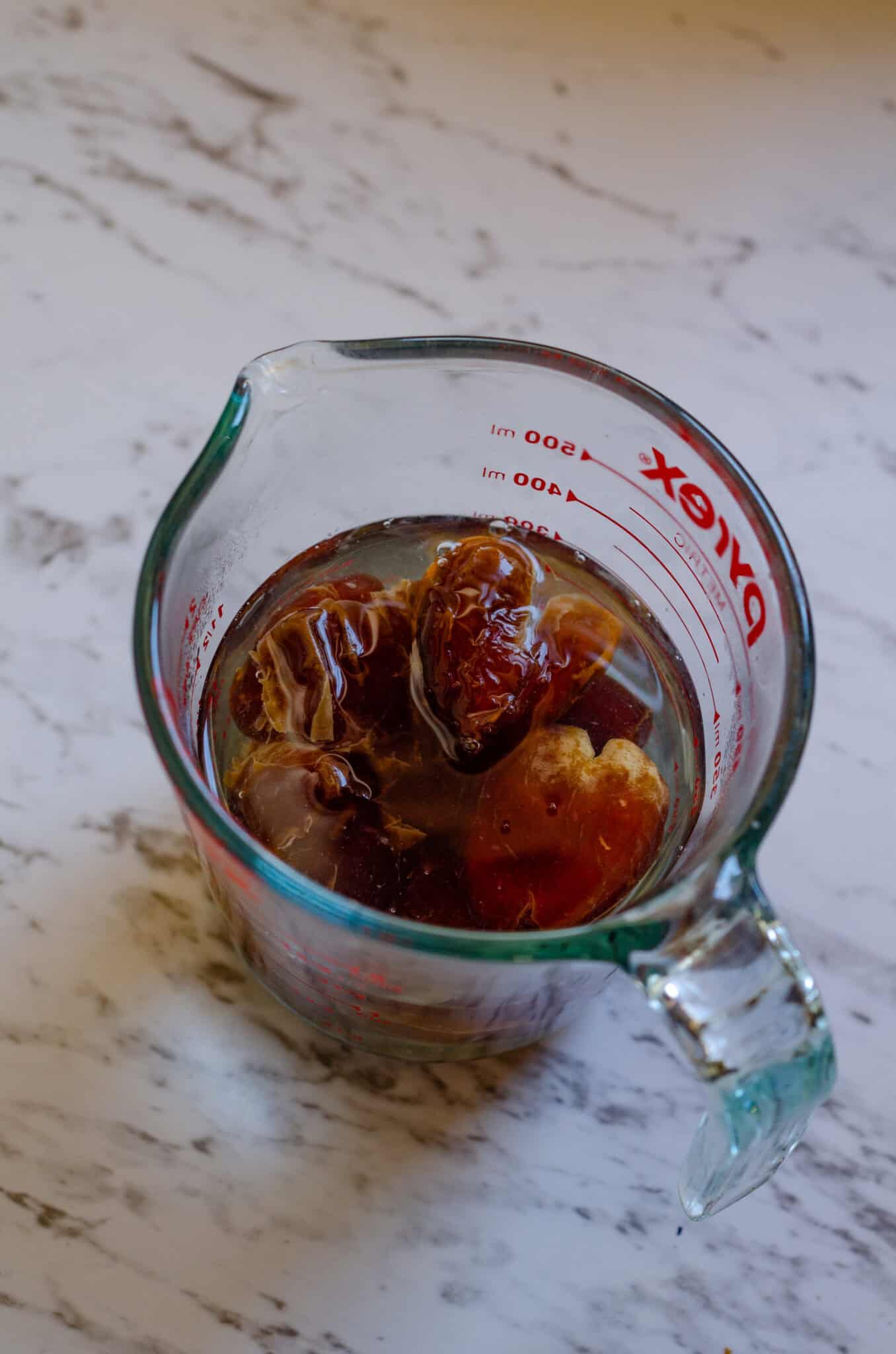 Dates sitting in a pyrex disk soaking.