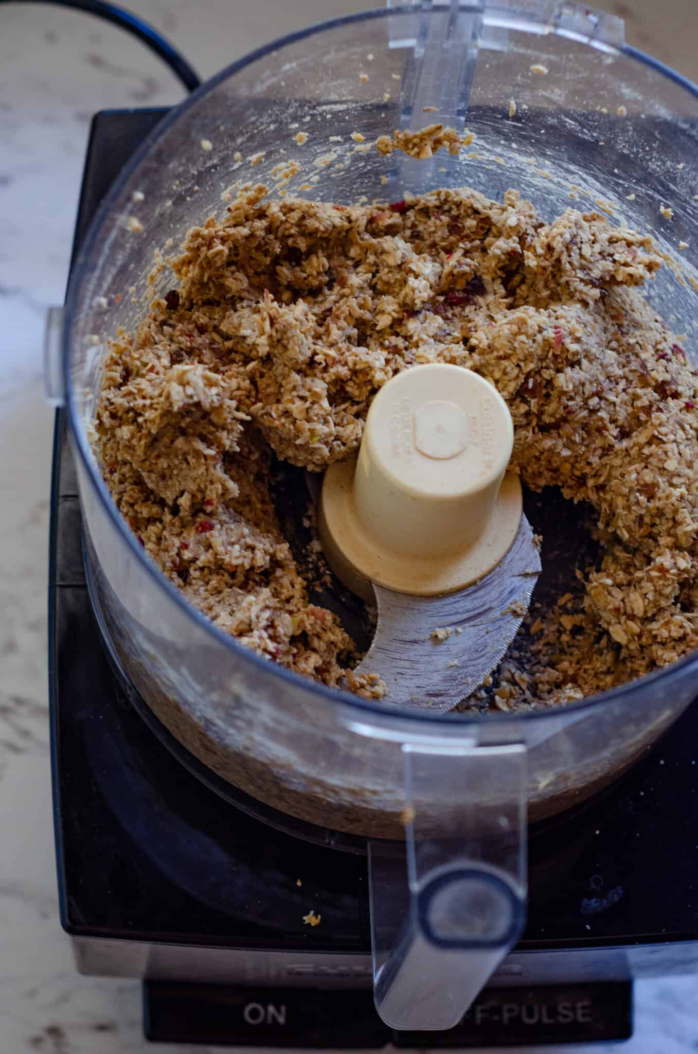 Apple energy balls with cinnamon dough in a food processor.