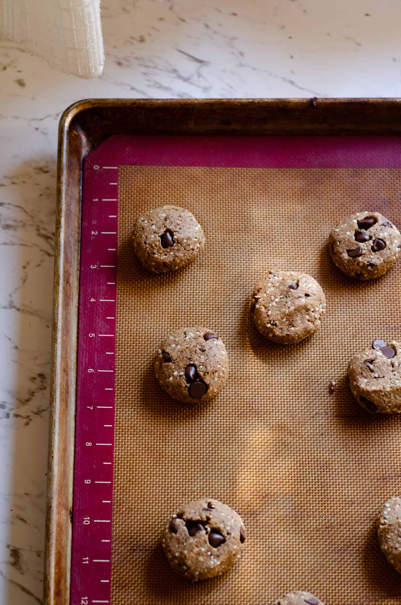 Hemp cookies freshly baked on a cookie sheet.