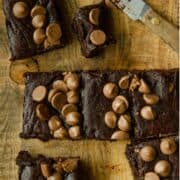 A gluten free brownie made with dates and cocoa powder with chocolate chips on top.