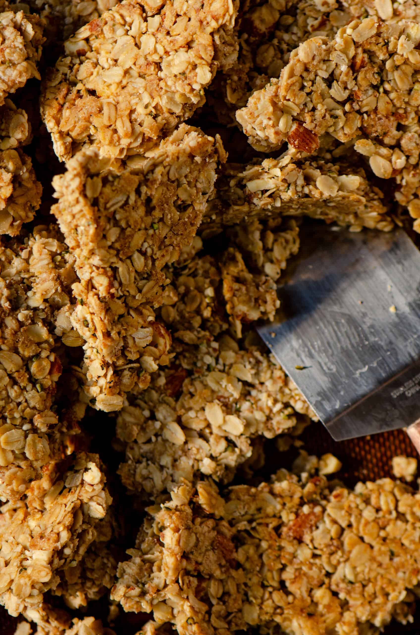 A baking sheet of granola chunks with oats and hemp hearts and almonds.