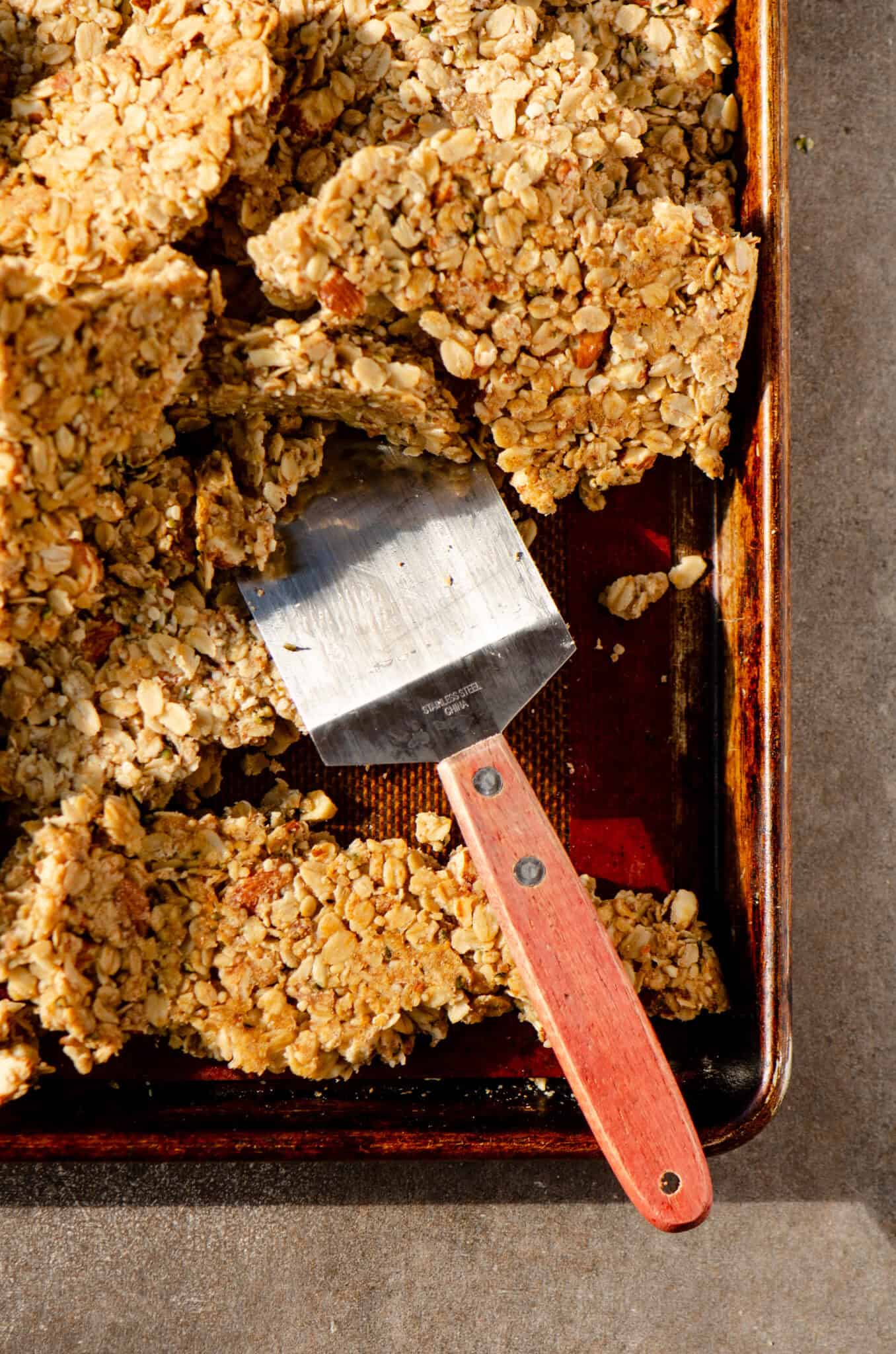 Clumps of granola being broken up.
