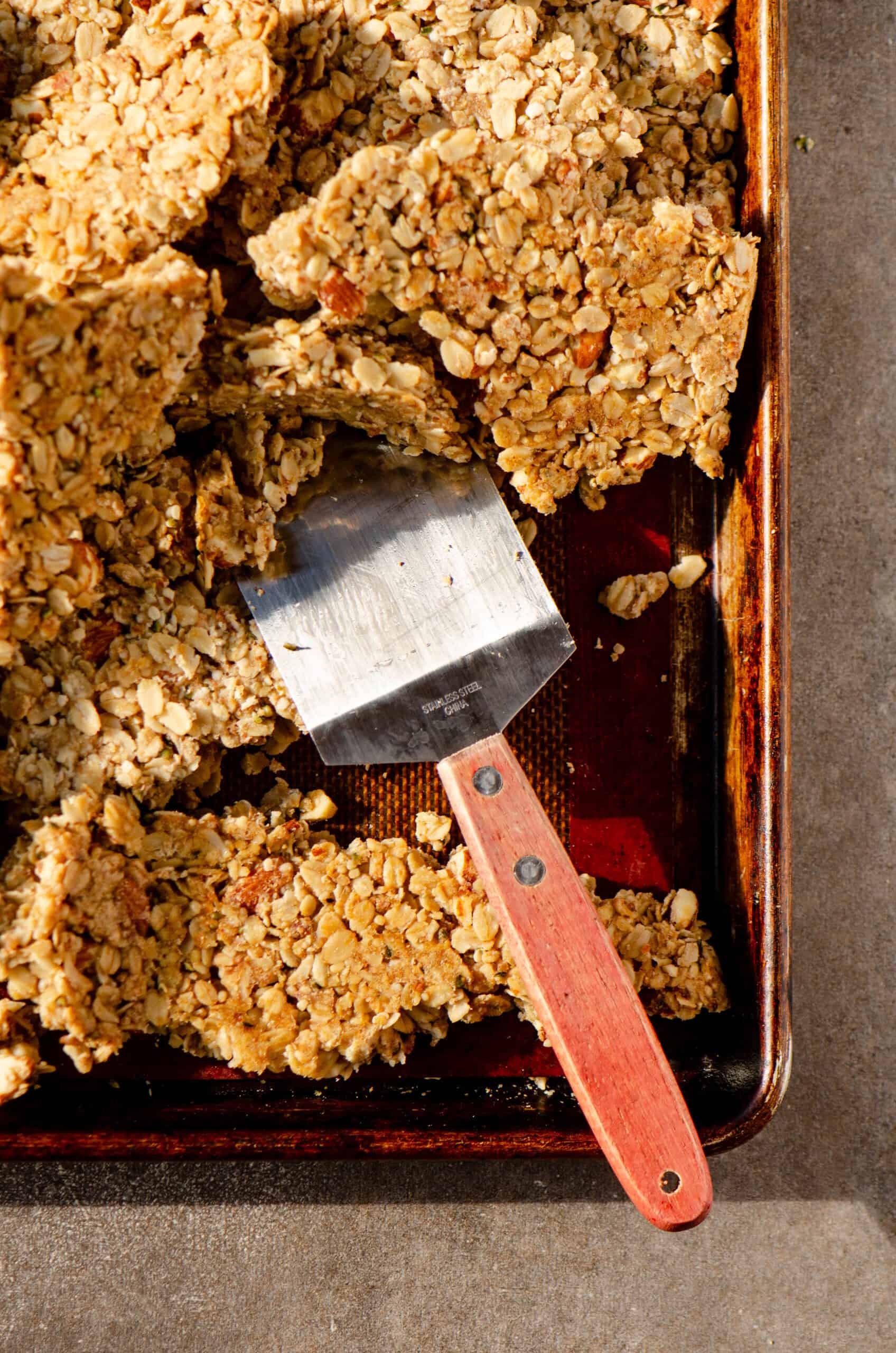 Clumps of granola being broken up.