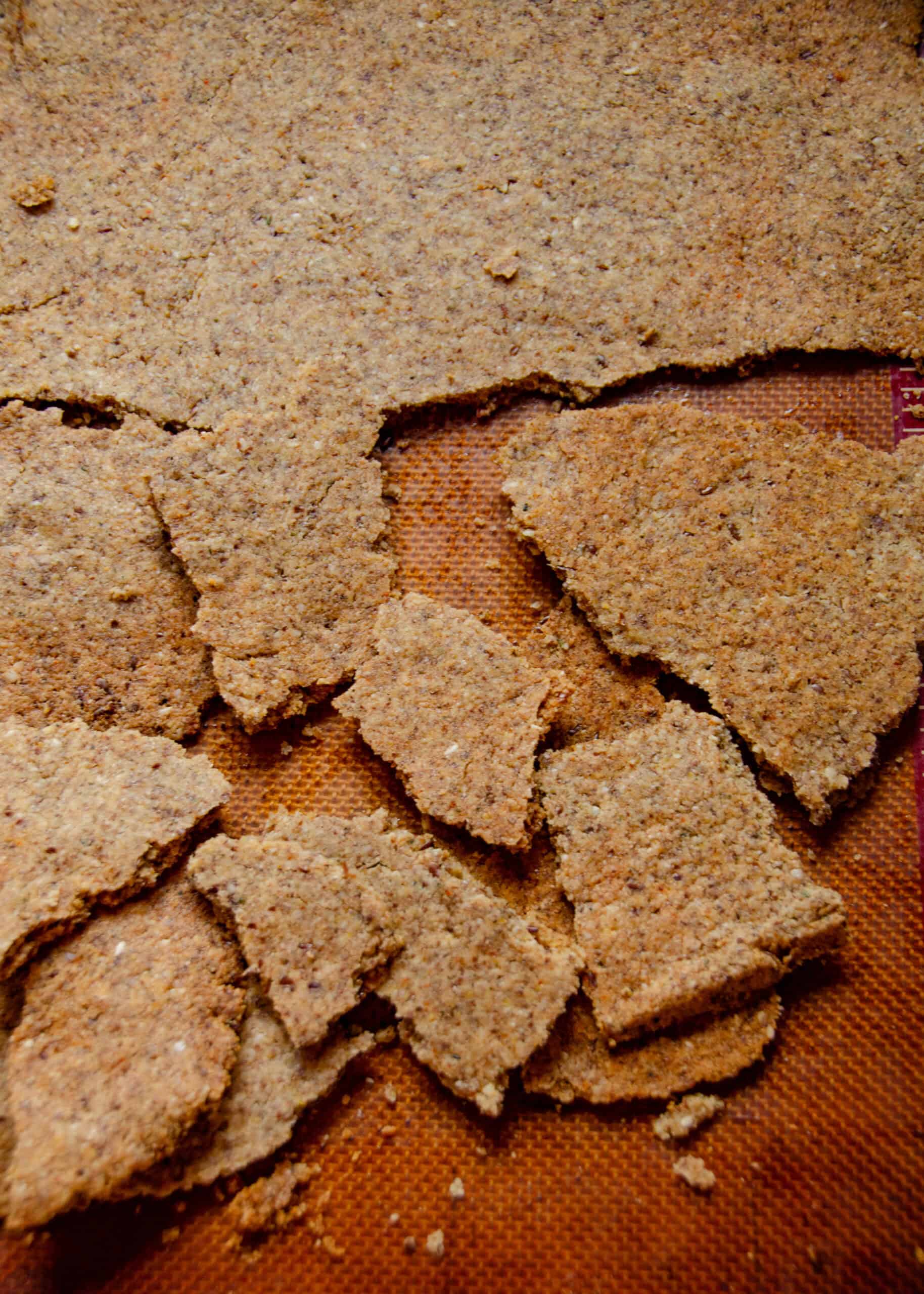 Brown crackers broken into bite size pieces.