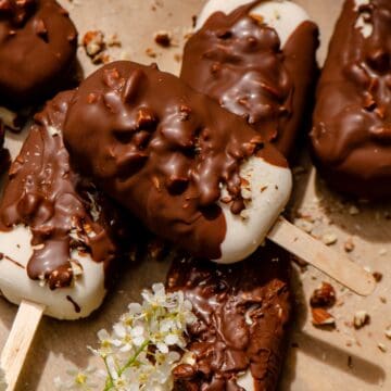 Chocolate covered ice cream bars dipped in nuts.