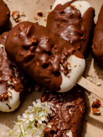 Chocolate covered ice cream bars dipped in nuts.