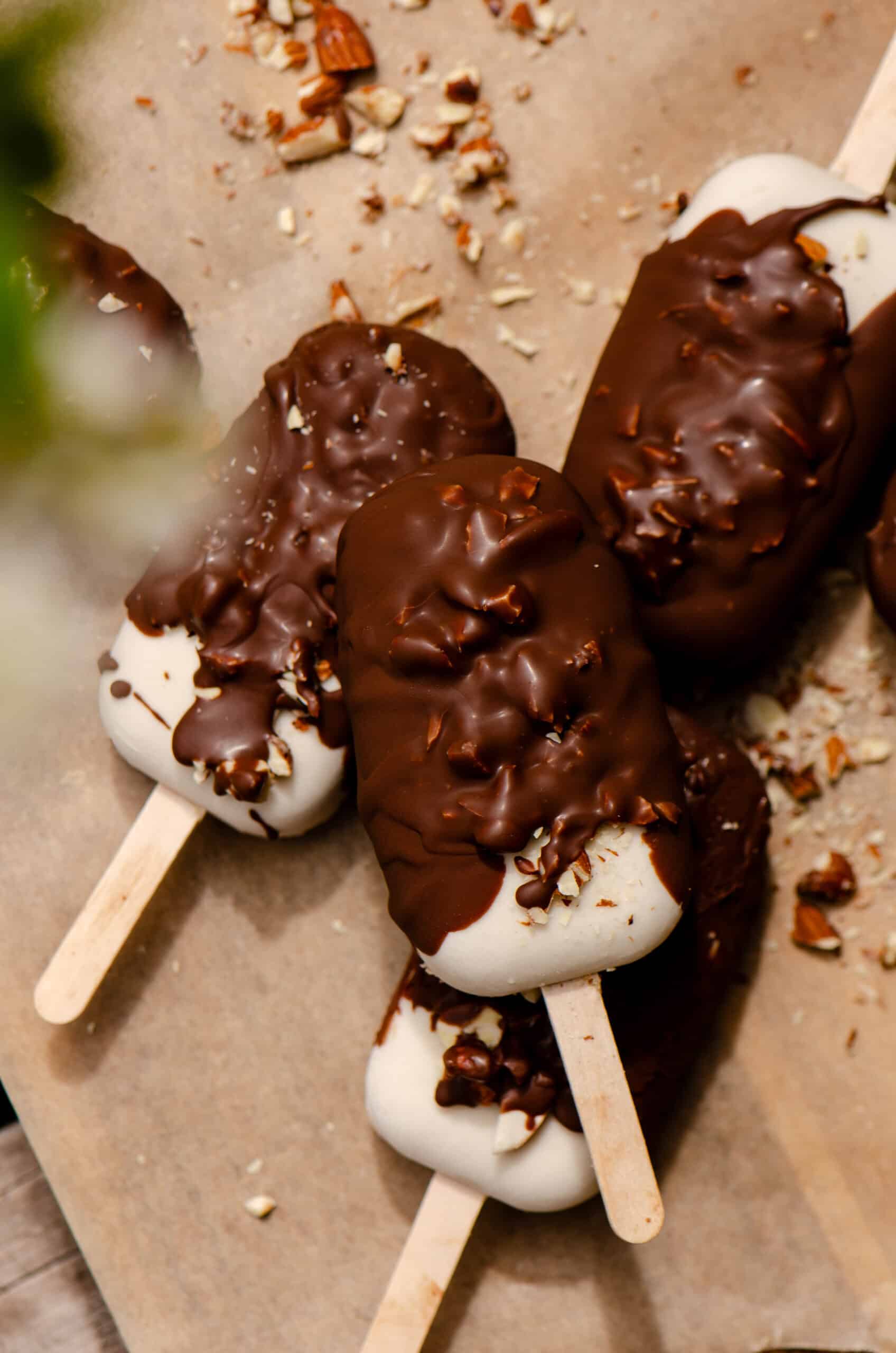 Chocolate covered ice cream bars dipped in nuts.