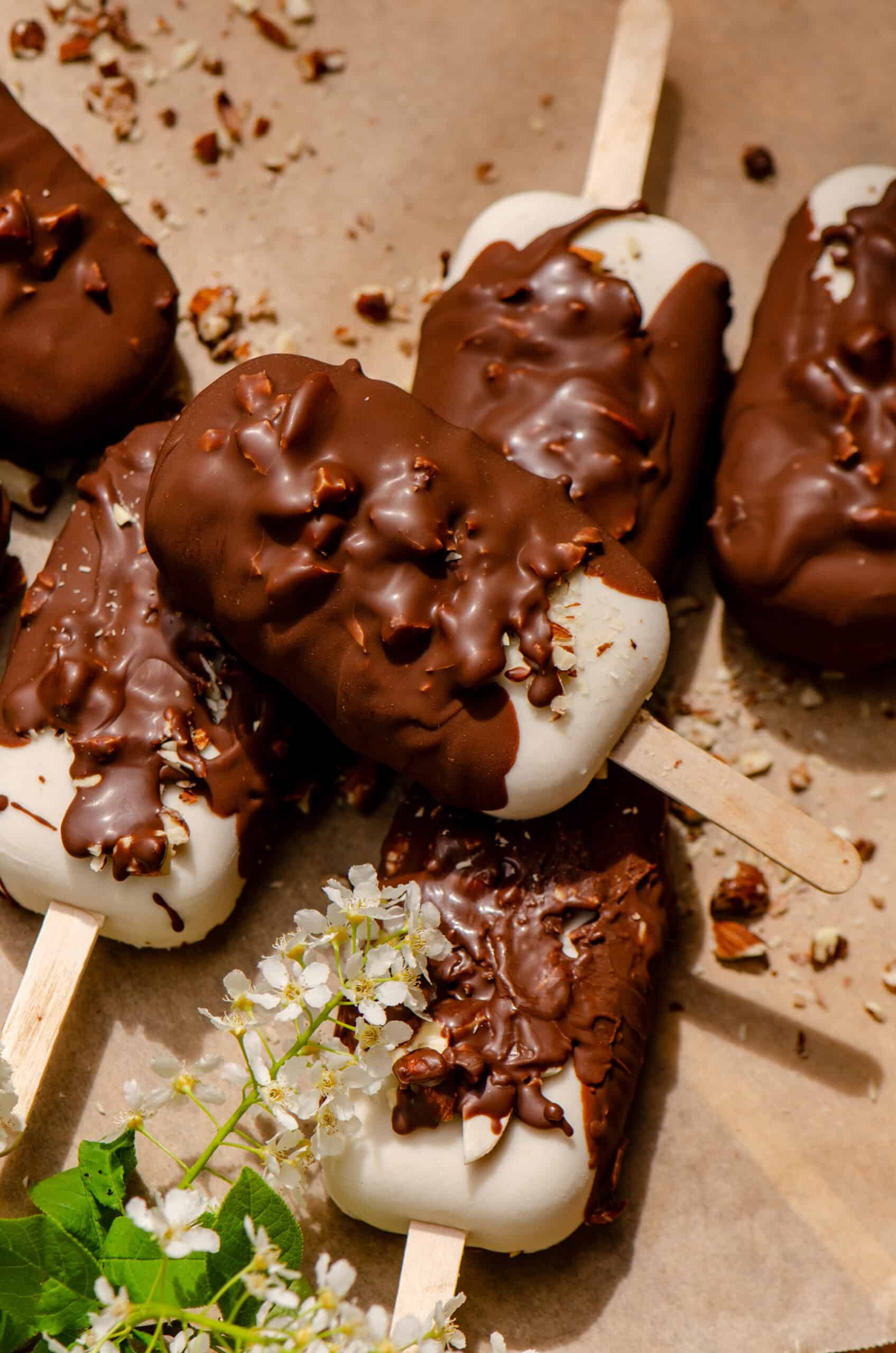 Chocolate covered ice cream bars dipped in nuts.