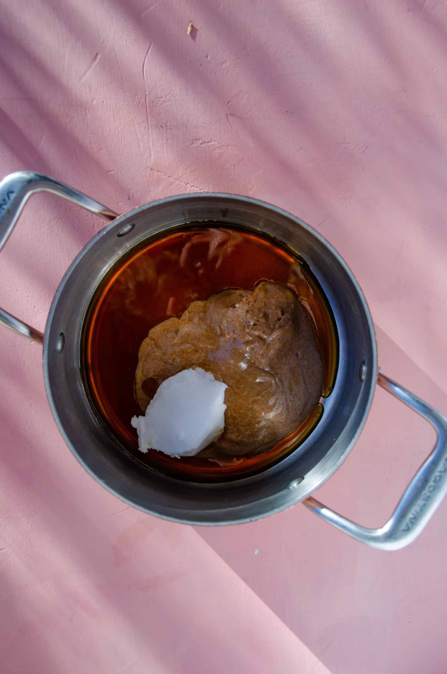 Almond butter, maple syrup, and almond butter in a pot.