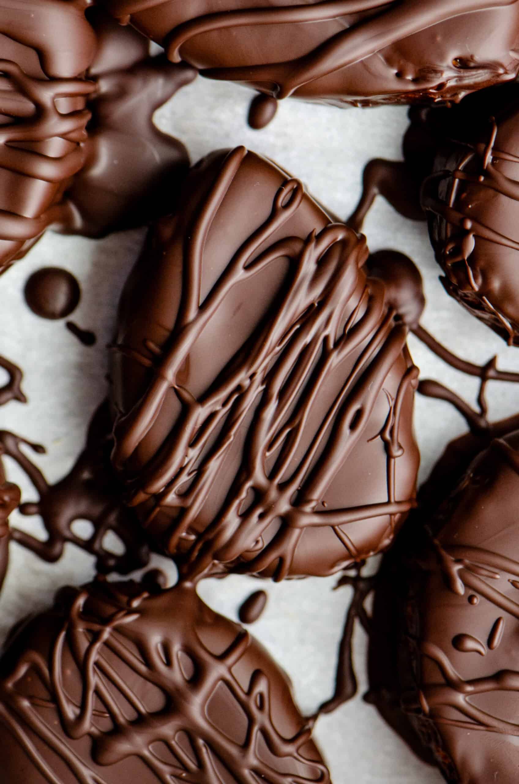 A chocolate easter egg with a chocolate drizzle on top