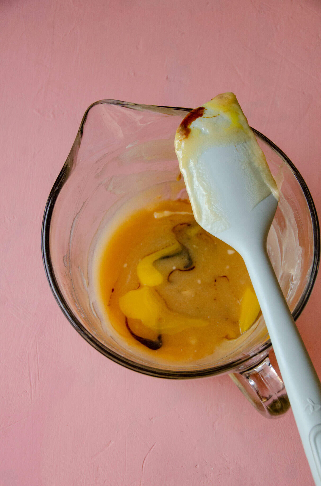 Egg, molasses, in a mixing bowl with butter and honey.