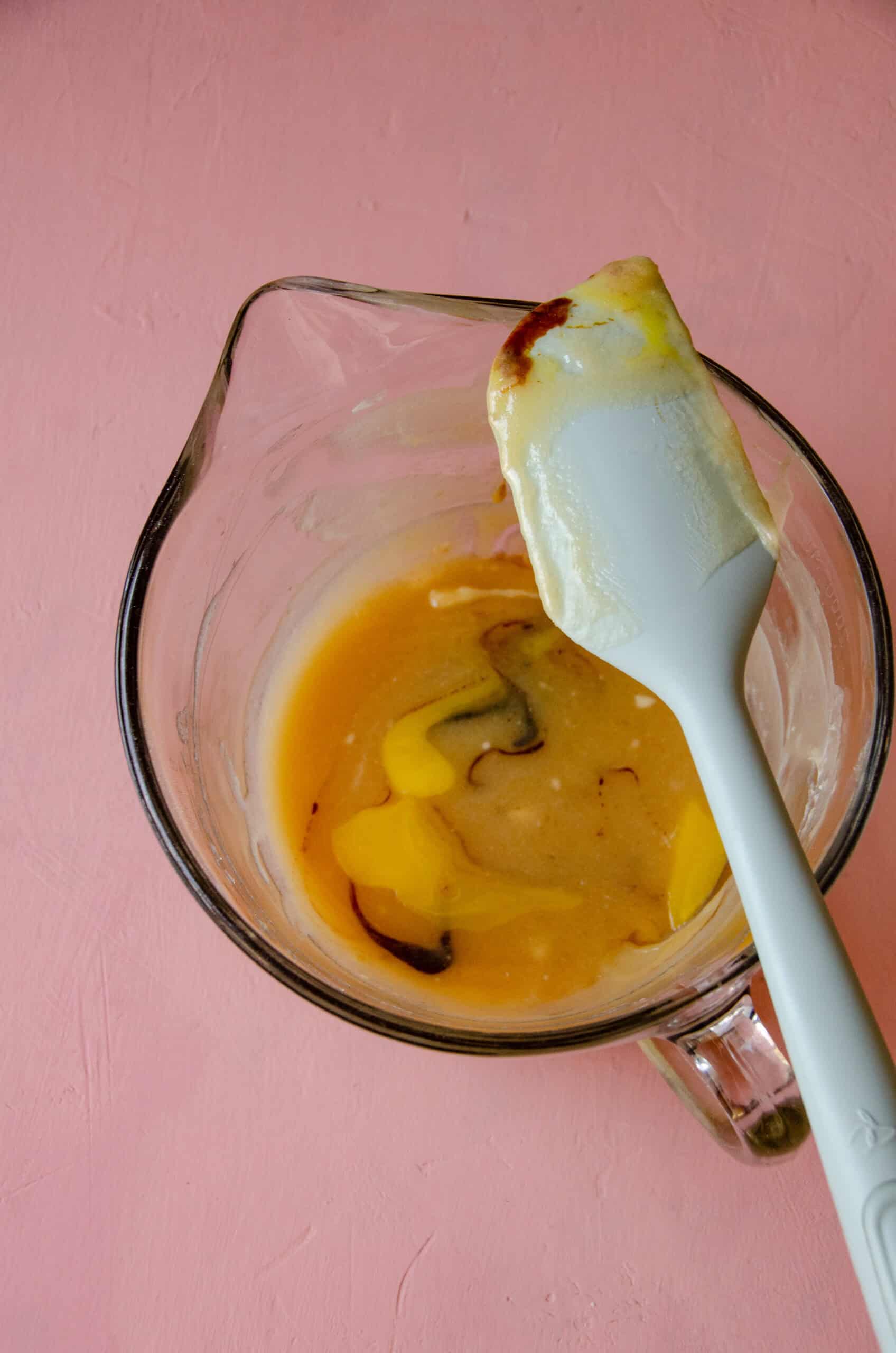 Egg, molasses, in a mixing bowl with butter and honey.