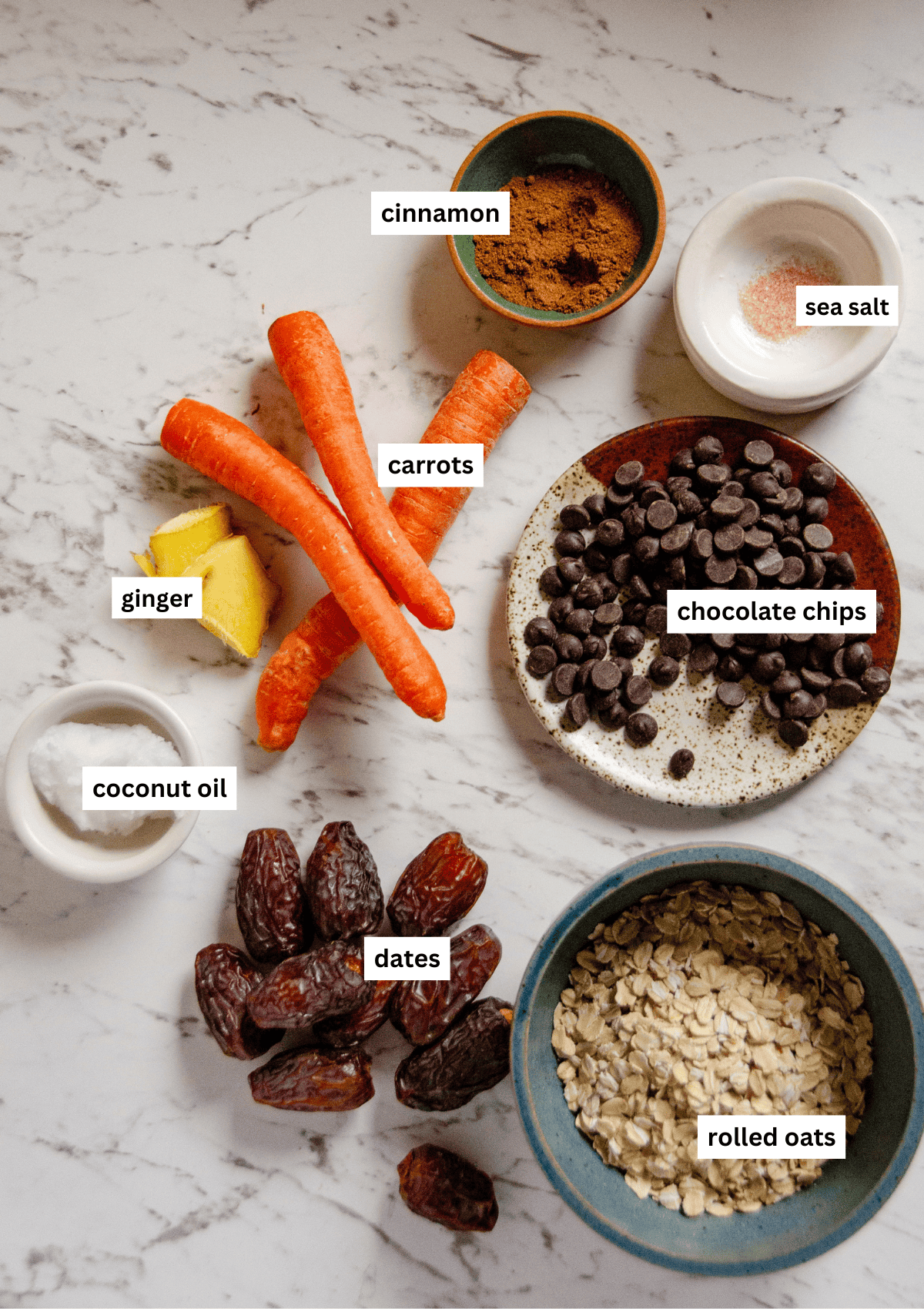 Ingredients needed for healthy easter eggs, including carrots, ginger, cinnamon, coconut oil, dates, rolled oats, chocolate chips, sea salt, cinnamon.