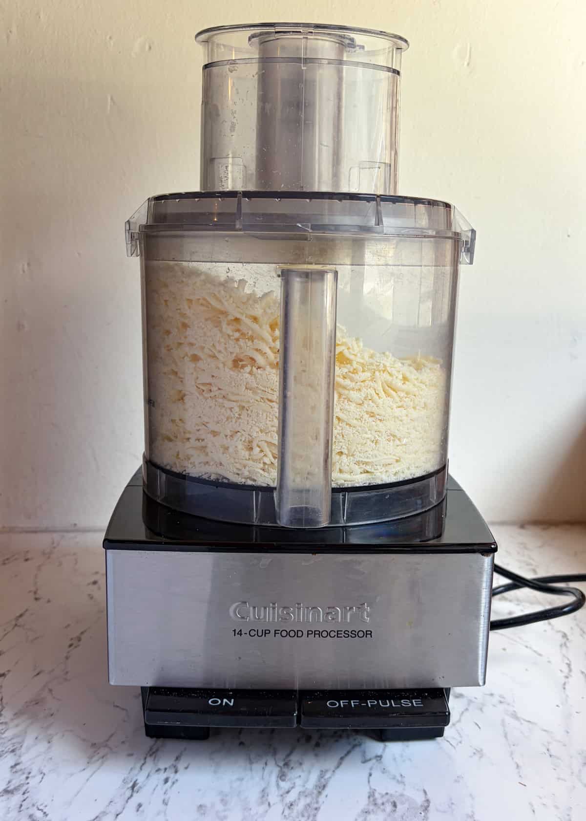 Grated cheese in a food processor.